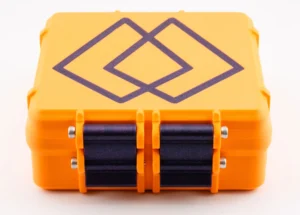 Nexaph 3D-printed orange vial case with 25-slot insert and dark violet interior