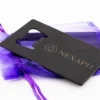 Black steel Nexaph vial opener with engraved logo and purple gift pouch
